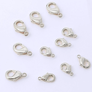 Macro shot of high-quality polished silver lobster clasps for DIY jewelry making