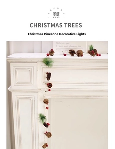 Detail of Christmas garland with natural pinecones red berries and pine needles for decor