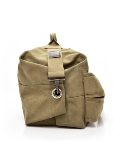 Side view of a khaki canvas travel backpack with multi-pockets and durable metal hardware