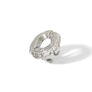 Detailed view of silver irregular open ring with lava texture and crinkled finish