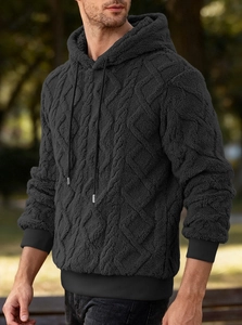Detail of men's black fleece hoodie showing the unique cable knit diamond texture