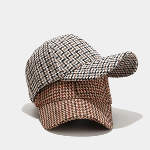 Classic houndstooth baseball cap in black and brown wool blend with curved brim design