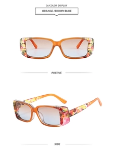 Detail view of orange square sunglasses with floral temple patterns and gradient lenses