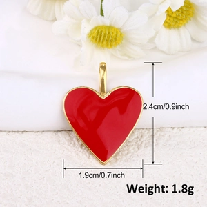 Detail view of a 1.9cm wide red heart pendant with 18k gold plating dimensions