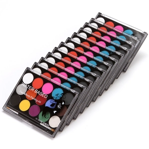 Stack of 15-color water-based face and body painting kits with a small application brush
