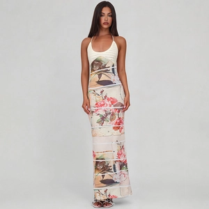 Detail of a beige knit halter neck bodice with rose floral print long skirt on a model