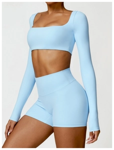Detail of light blue square neck long sleeve crop top and high waist sports shorts