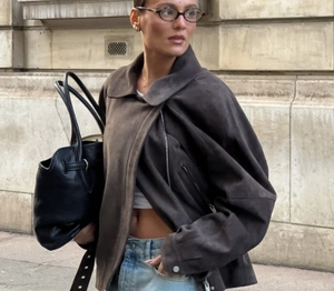 Chic dark brown faux suede biker jacket with belt styled in a vintage street look