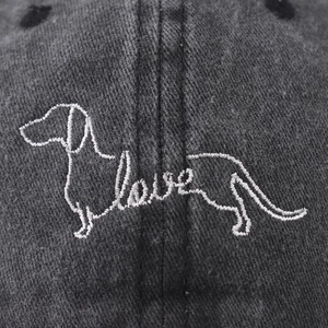 Washed dark grey cotton baseball cap featuring embroidered dachshund dog and love text