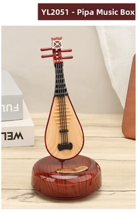 Detailed view of vintage pipa music box featuring intricate wood texture and golden plaque