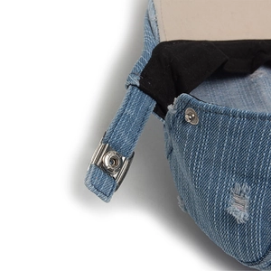 Blue denim newsboy cap with distressed details and adjustable silver metal back buckle strap