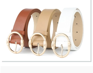 Brown, beige and white leather belts for women featuring golden oval buckles on white backdrop