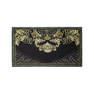 Detail of baroque gold crown prints and leopard pattern on black swimsuit fabric