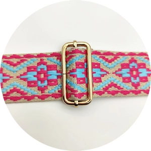 Macro detail of ethnic style woven strap with golden metal slider for handbags