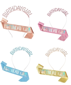 Detail view of four glitter birthday sashes and matching rhinestone tiaras set