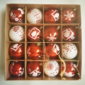 Detail of 16 hand-painted red and white Christmas balls with snowflakes in a gift box