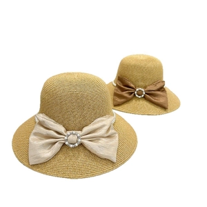Elegant paper straw sun hat with large satin bow and pearl rhinestone buckle detail