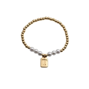 Elastic beaded bracelet with gold metal spheres, white pearls, and a gold letter T pendant