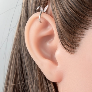 Sweet silver rabbit ear cuff clip earrings for non-pierced ears on a female model