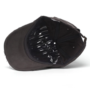 Washed cotton distressed baseball cap in dark grey with vintage torn details and metal buckle