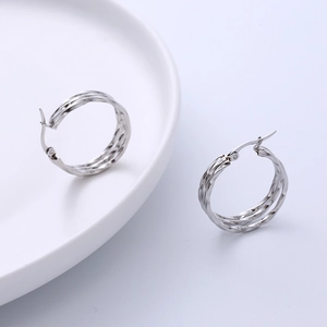 Three-layer silver twist hoop earrings in a minimalist stainless steel design for women