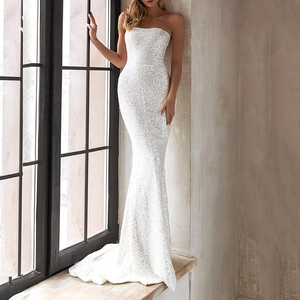 Slim fit white sequin strapless mermaid evening dress for women in a side view pose