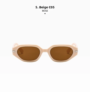 Detail of beige geometric cat-eye sunglasses with metal accents and brown lenses