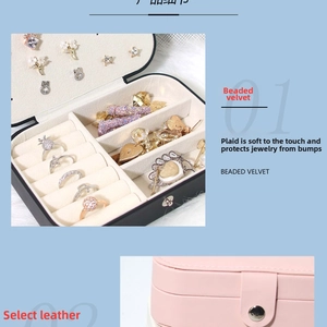 Close-up of portable jewelry box showing velvet ring slots and metal snap closure