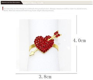 Detail shot of heart-shaped napkin ring with red rhinestones measuring 3.8cm by 4.0cm