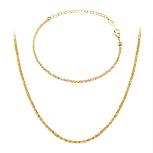 Minimalist 18K gold jewelry set with delicate wave chain necklace and bracelet