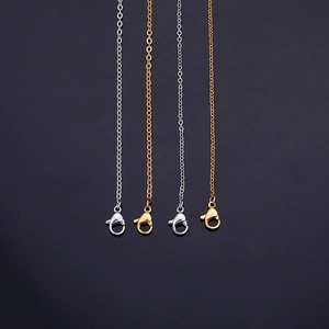 Sleek stainless steel cross chain necklaces with lobster clasps in gold and silver