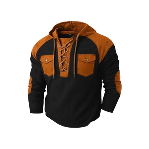 Men's hooded waffle knit sweater in black and brown contrast patchwork with front pockets