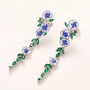 Elegant silver flower earrings with blue enamel petals and green zircon leaves drop