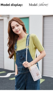Detail of colorful sequin mini bag featuring cute rabbit embroidery and metal clasp