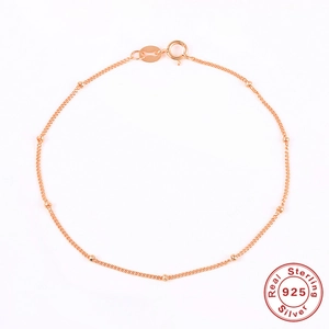 Detailed macro view of S925 sterling silver beaded chain with elegant rose gold plating