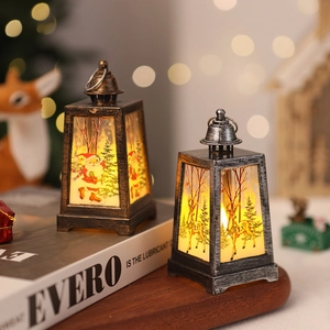 Close-up of vintage Christmas lanterns with Santa and reindeer motifs in warm lighting