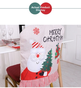 Detail of Christmas chair cover with Santa print and Merry Christmas text decor