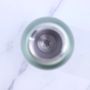 Close-up of the food-grade SUS 304 stainless steel interior of a mini vacuum cup