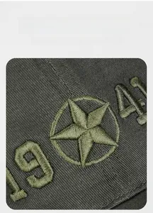 Detailed close-up of 1941 number and star embroidery on military green camo baseball cap
