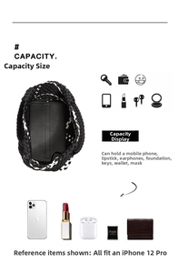 Detail view of woven tote interior capacity with daily essentials and phone pocket