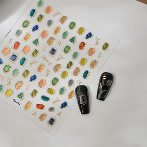 Detailed 3D embossed nail art stickers with gold foil gems and glitter starry sky design