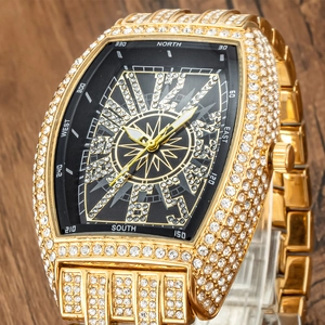 Macro detail of gold iced-out watch dial with compass markings and luxury diamonds