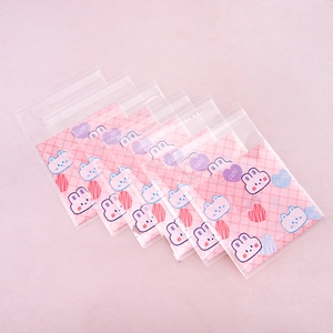Close-up of cute cartoon bunny self-sealing bags for cookies and jewelry storage