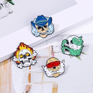 Set of four punk style skull enamel pins with smoke and fire designs for biker jackets