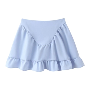Flat lay of light blue ruffle mini skirt with elegant pleats on white background
