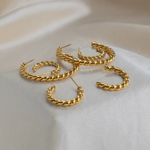 Three pairs of 18K gold plated twisted rope C-shape hoop earrings in assorted sizes