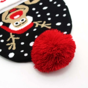 Knitted Christmas beanie with red pom pom and cartoon monkey pattern in black