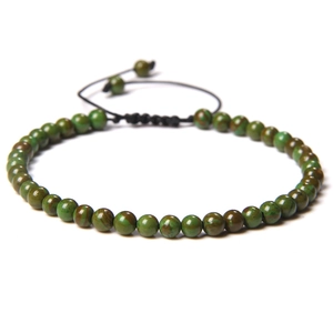 Close-up of 4mm green stone beads with adjustable black nylon cord and marble texture