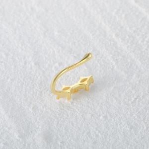 Close-up of golden S925 sterling silver nose cuff showing the hallmark and stone detail