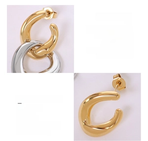 Detail of interlocking two-tone 18K gold plated titanium steel earrings with detachable rings
